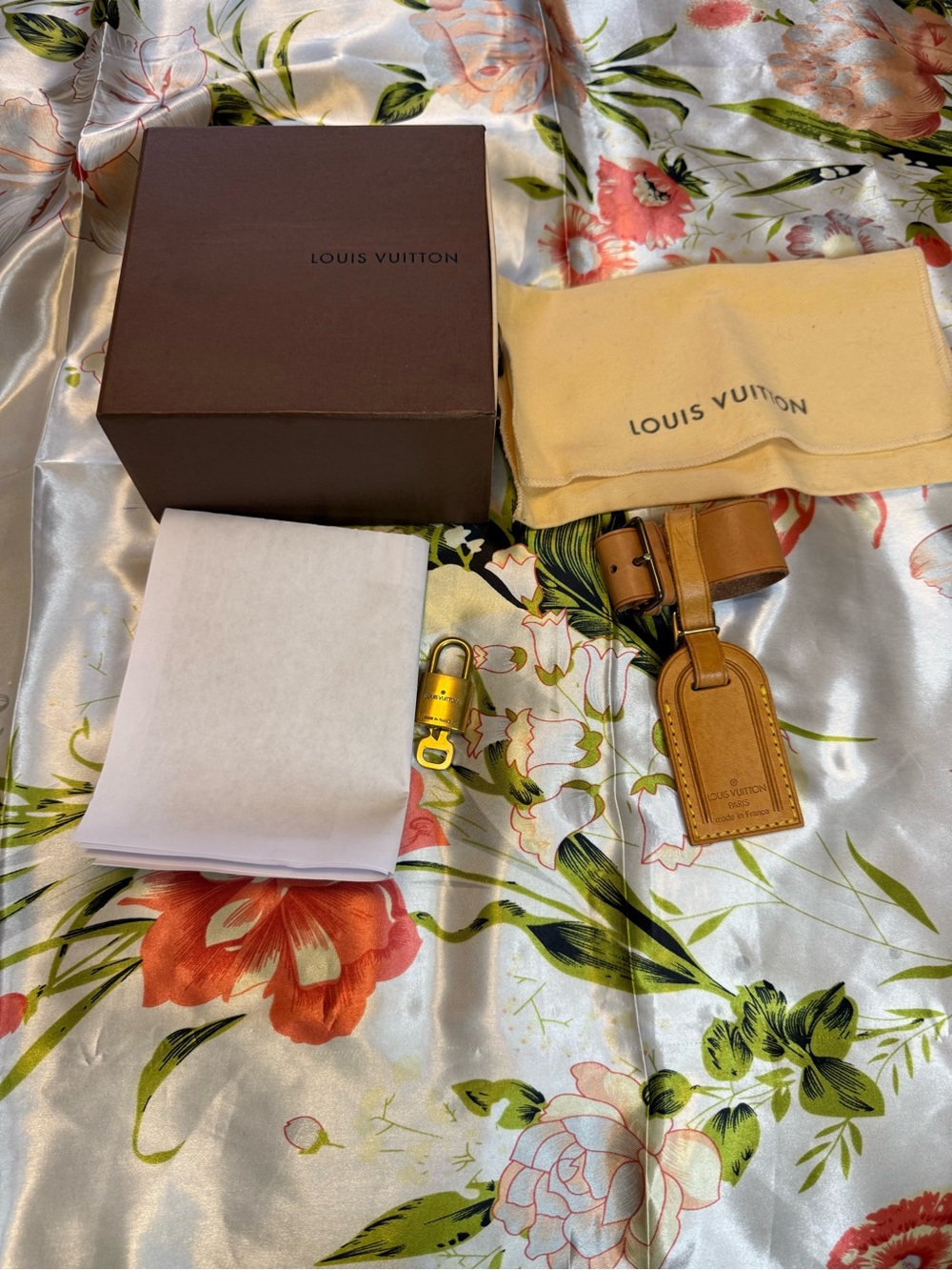 Louis Vuitton Vachetta leather luggage tag, poignet, and padlock set